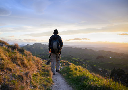 Hiking Te Mata Peak. Setting sun casting a warm glow on rolling hills. Hawkeâs Bay.の写真素材
