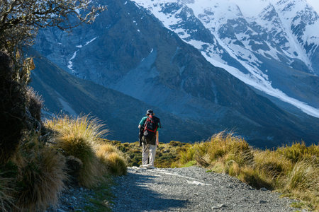Man hiking Hooker Valley track. Mt Cook National Park. New Zealand.