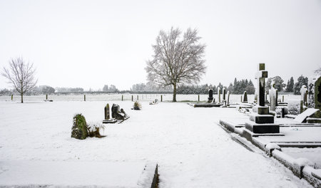 Cemetery covered in white snow.の写真素材