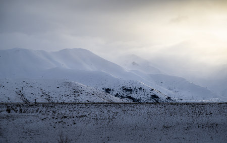 Snow-capped mountains after the storm. View from Loch Cameron. Twizel. New Zealand.の写真素材