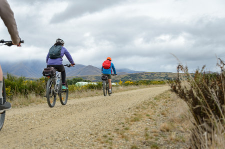 Couple cycling Otago Central Rail Trail. South Island. New Zealand.の写真素材