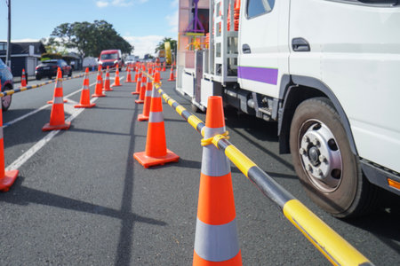 Work truck and traffic cones on the street. Roadworks in Auckland.の写真素材