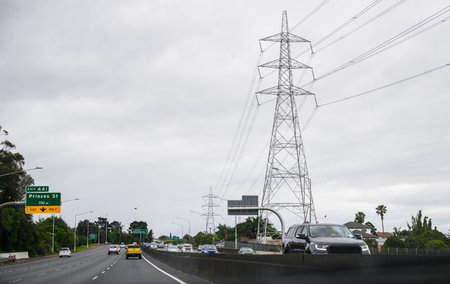 Power pylons and power lines along the motorway. Auckland.の写真素材