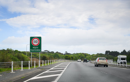 110 km/h speed limit road sign at Kapiti Expressway. Cars and Motorhome travelling on the expressway. New Zealand;の写真素材
