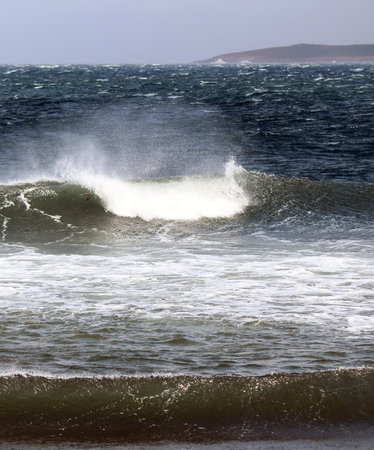 A sunny but very windy fall day with white top waves