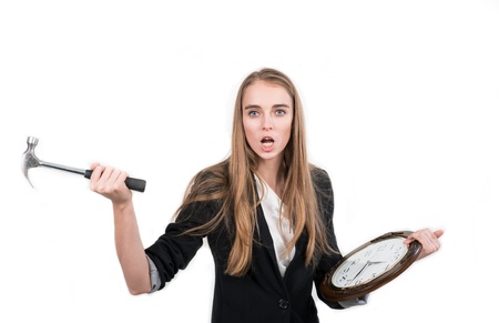 woman tries to stop the clock timeの写真素材