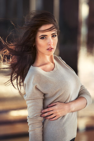 Beautiful sexy woman with perfect body posing outdoorsの写真素材