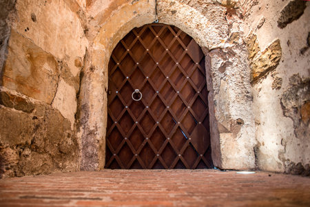 Metal massive door in a stone caveの写真素材
