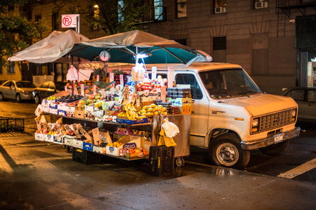 New York City, JUNE 1, 2015: Fruit car store at Mannhattan street at the nightのeditorial素材