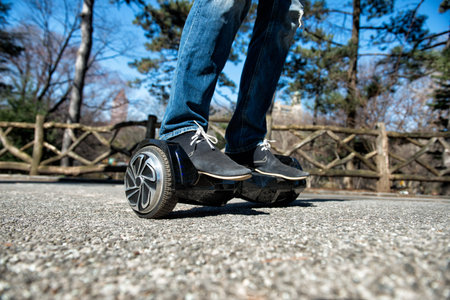 Man riding on hoverboard in the park