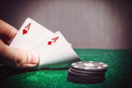 aces and chips on a green felt