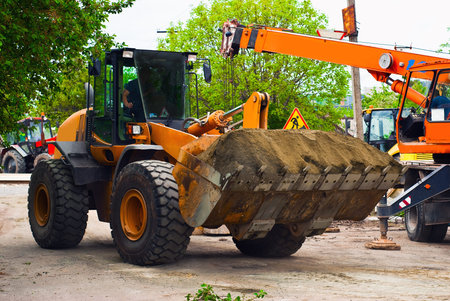 Excavator for road works