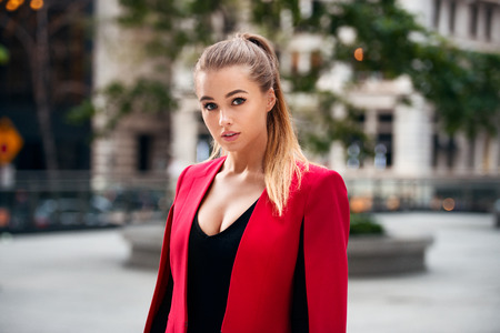 Portrait of a sexy beautiful businesswoman walking in a cityの写真素材