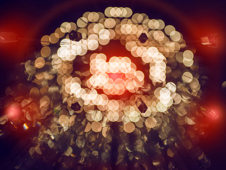 gold abstract background with bokeh defocused lights and red flashesの写真素材