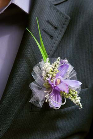 boutonniere flower in the pocket of the groom on wedding ceremony
の写真素材