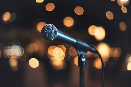 Microphone on stage against a background concert or showの写真素材