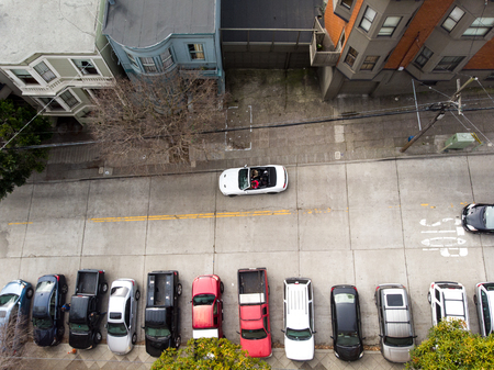Residential parking on city street of San Francisco with cars on it.の写真素材