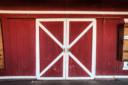 Classic american red  and white barn wooden doorsの写真素材
