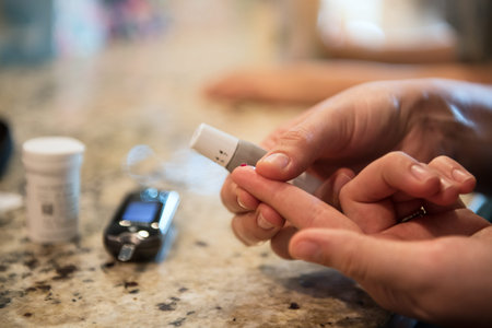 Woman using diabetes healthcare blood sugar glucose measurement system at home