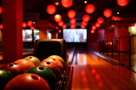 Bowling lane and balls in the row in bowling center.の写真素材