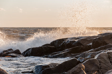 Waves hitting the rocks on the shore of the Baltic Sea in Reposaari, Finlandの写真素材