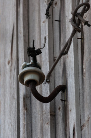 Old electrical equipment on a wooden wallの写真素材