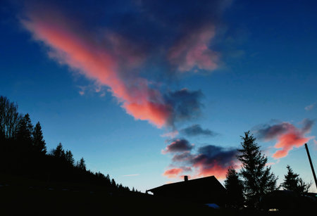 Evening Sky with Pink Clouds over Rougemont Switzerland