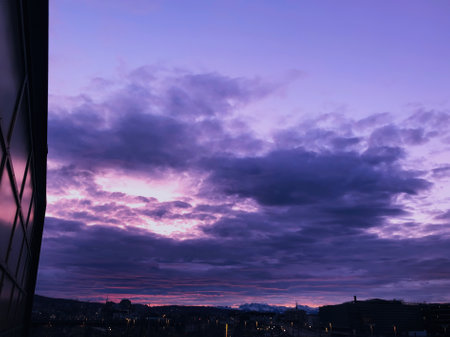 Colorful morning sky with clouds at HardbrÃ¼cke railway station in December 2020, Zurich, Switzerlandの写真素材