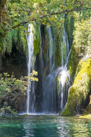 cloesup of waterfalls in the sun at turquoise plitvice lakes in national park in croatiaの写真素材