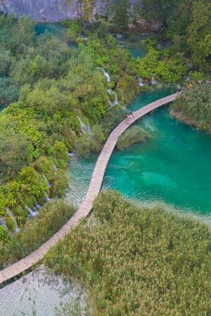 aerial view of wooden boardwalk over plitvice lakes and waterfalls in national park Croatiaの写真素材