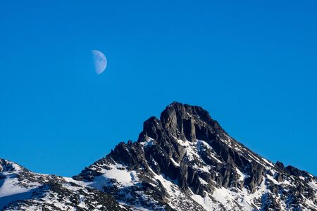 Moon rising over the scenic mountain range near garibaldi lake, Canada, BCの写真素材