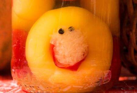 smiley face in jar of pickled fruits and vegetables foodの写真素材