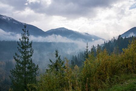 mountain landscape in the clouds, Canada road trip in fallの写真素材