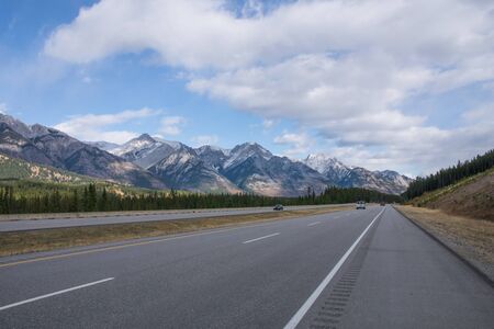 mountain range in banff national park seen from the highway, road trip Canada in fallの写真素材