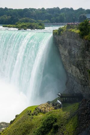 side view on to the horseshoe with behind the falls attraction in front on a sunny summer day, Niagara falls, Canadaの写真素材