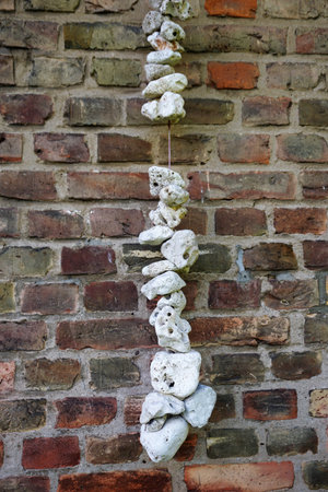 Bricks with stone chain on farm houseの写真素材