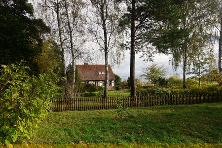 Old brick farm house with plantsの写真素材