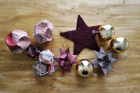 Christmas decoration of red stars of paper on wooden tableの写真素材