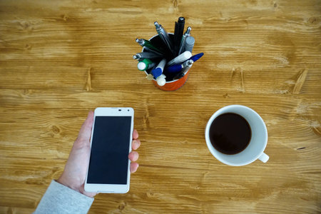 Home office phone call with coffee