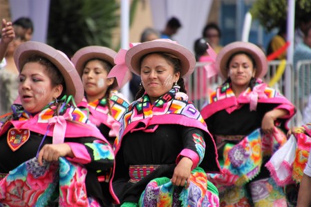 Girls dancing a national folk dance in Peru with costumesの写真素材