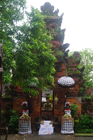 Balinese temple gate entrance with plants in Bali Indonesiaの写真素材