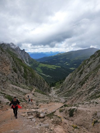 Girl hiking in the mountains with hiking polesのeditorial素材