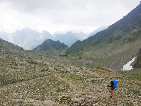 Hiking girl walking on a stony path in the mountainsのeditorial素材