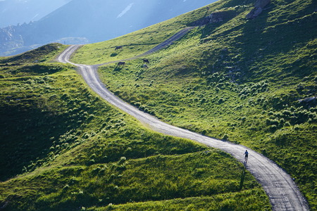 Hiking in the mountains on a long path or trackのeditorial素材