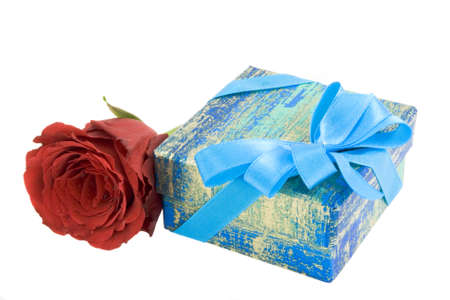 Gift box with ribbon and red rose isolated on whiteの写真素材