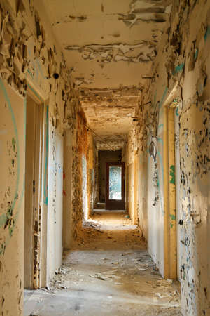 Destroyed corridor in an abandoned buildingの写真素材