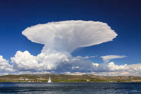 Huge cumulonimbus cloud over the sea coast. Photo taken in Dalmatia (Croatia)の写真素材