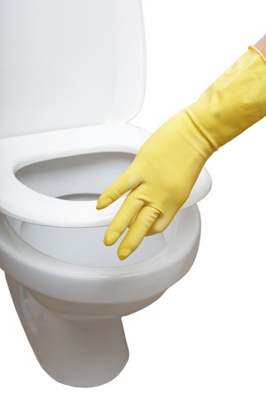 Gloved hand closing wc.の写真素材