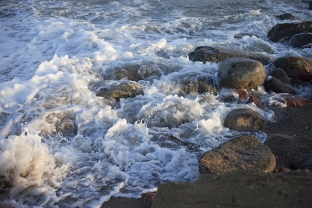 Stones in waves.の写真素材