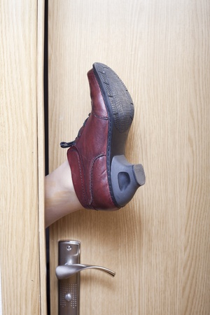 Leg opening the door.の写真素材